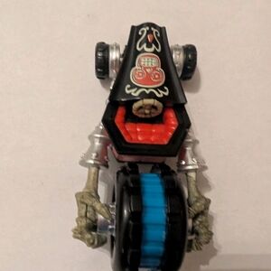 Skeleton-Themed Toy Vehicle with Blue and Black Accents